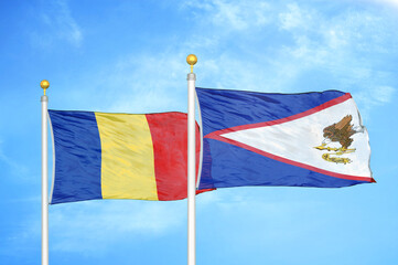 Romania and American Samoa two flags on flagpoles and blue sky