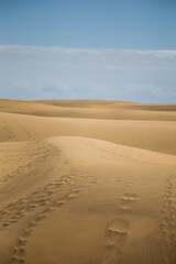 Vertical sand dunes and blue sky in Maspalomas Gran Canaria