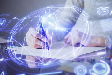 Education theme hologram over woman's hands writing background. Concept of study. Double exposure