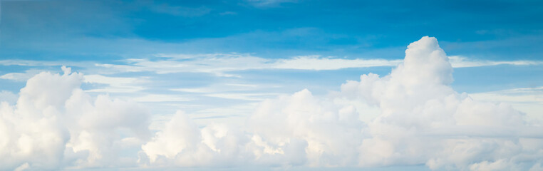 Fototapeta na wymiar Beautiful blue sky with white fluffy clouds.