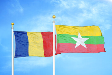 Romania and Myanmar two flags on flagpoles and blue sky