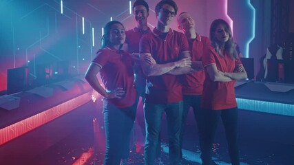 Diverse Gamers Esport Team Steps forward on a Stage Ready to Win Video Games Tournament, Posing at Tough Guys and Girls. Stylish Neon Championship Arena for Online Streaming of Cyber Games 