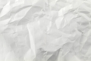 A crumpled sheet of white paper close-up fills the entire picture