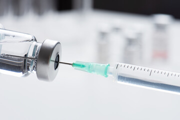 Vaccine bottle and syringe closeup