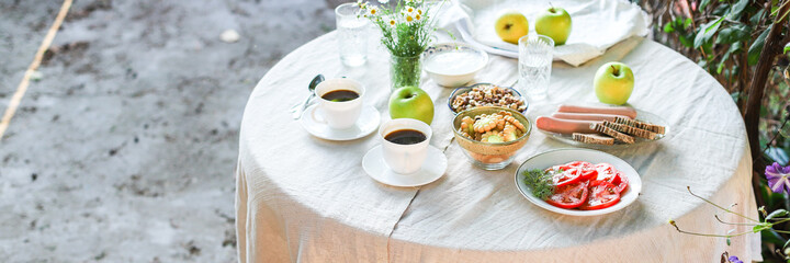 coffee and breakfast on the table outdoor country terrace
food background top view copy space for text organic healthy eating