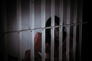 Hands of women desperate to catch the iron prison,prisoner concept,thailand people,Hope to be...