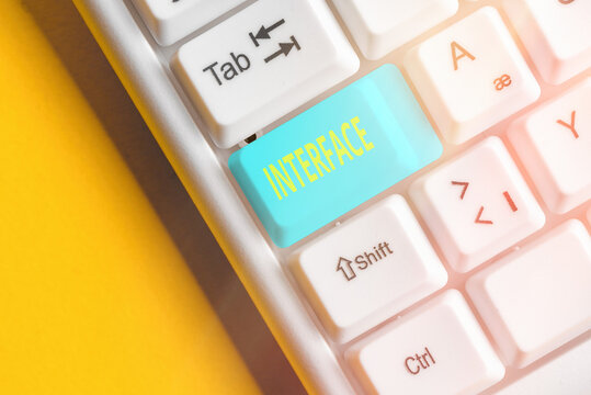Word writing text Interface. Business photo showcasing the means by which interaction or communication is achieved Different colored keyboard key with accessories arranged on empty copy space