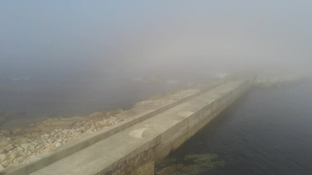 Rocky coast in Galicia with fog. Aerial Drone Footage