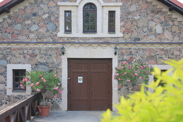 Fototapeta na wymiar Entrance to the old house made from stones