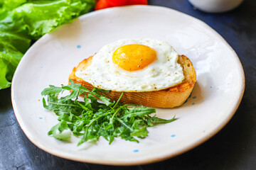 fried egg and toast bread salad delicious breakfast snack yolk and protein portion serving food background top view copy space eating healthy raw Takeaway