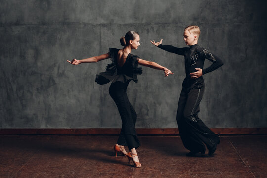 Young Couple Dancing In Ballroom Dance Cha Cha Cha