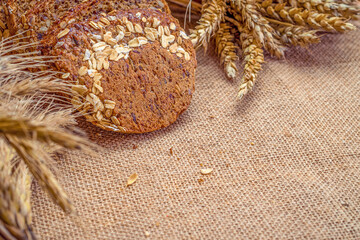 Home baked bread. Rye bakery with crusty loaves and crumbs. Fresh rustic traditional bread with...