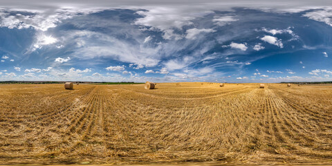 full seamless spherical hdri panorama 360 degrees angle view among harvested rye and wheat fields with Hay bales in summer day with beautiful cirrocumilus clouds in equirectangular projection