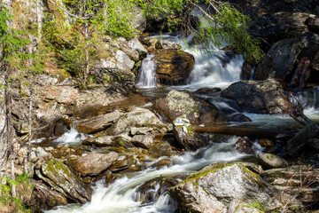 Obraz premium Waterfalls on a mountain river close up