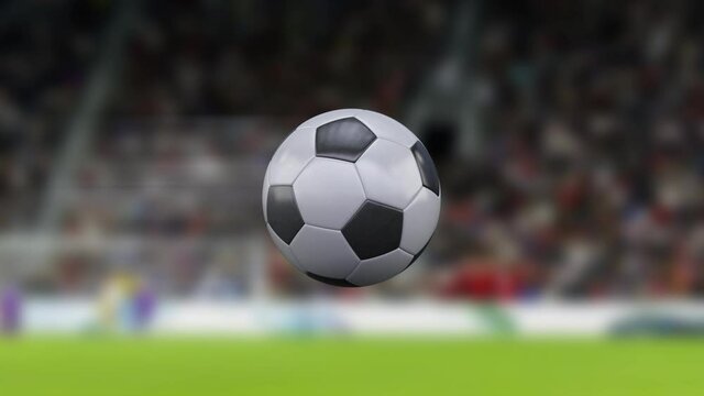 Football game. 4k football or soccer ball flying through the air in slow motion