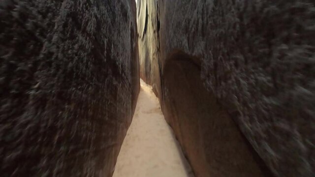 Slot canyon sandy path walking Utah desert pov. Natural erosion formed narrow steep box slot canyon on lake shore. Beautiful man made reservoir on Colorado River Utah and Arizona.