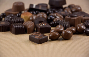 Chocolate pralines on a brown background stock images. Chocolate pralines on a brown background...