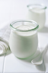 Natural organic yogurt in a vintage glass jar.