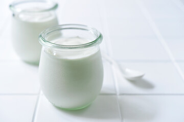 Natural organic yogurt in a vintage glass jar.