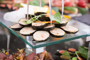 Assortment festive appetizers on the plate, selective focus. Festive buffet