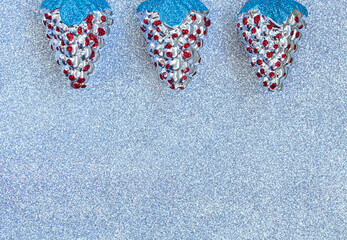 New Year cones on silver background. Copy space for design and text