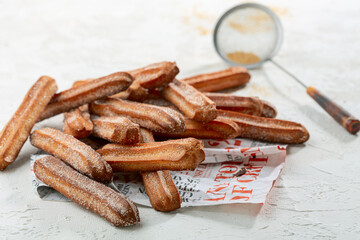 Churros with cinnamon sugar. Traditional Spanish dessert.