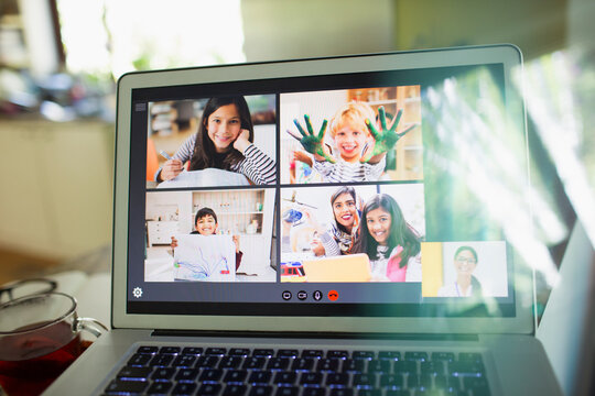 Students and teacher e-learning on laptop screen