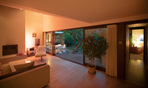 Illuminated home showcase interior with open patio doors