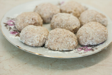 homemade meatballs on the plate in the kitchen - making minced meatballs, traditional Italian cuisine