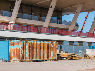 Odessa, Ukraine - August 15, 2016: Metal containers and building materials. Stopped restoration at...