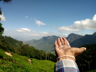 Bokeh shot of the transparent Shivalingam of lord Shiva with selective focus and mountains...