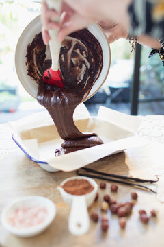 Woman baking homemade chocolate brownies