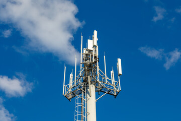Telecommunication tower with 4G, 5G transmitters. Cellular base station with transmitter antennas...