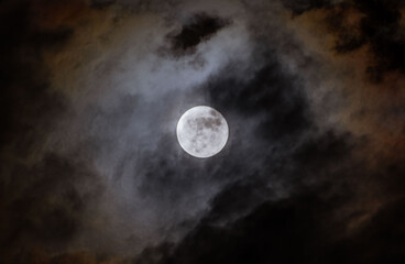 Buck Moon under the clouds