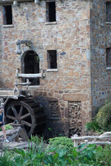 Old Stone grist mill with a mill wheel