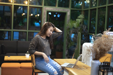 Ordinary woman webcam talk on laptop. Asian female have fun talk on video during coronavirus outbreak at living room.  Modern app tech usage,  New Normal, Quarantine, Social Distancing concept