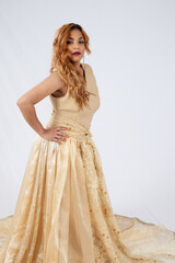 Fototapeta premium Pretty Hispanic woman with a fancy dress and her hand on her hip