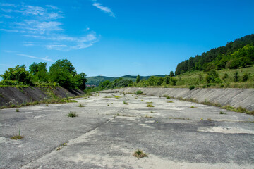 the bed of a dried concrete channel
