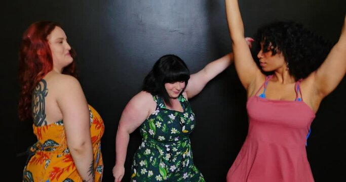 Three women posing for studio portraits. Celebrating and having fun. Concept about lifestyle and body positivity