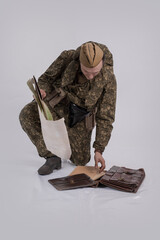 A male actor in the historical uniform of an officer of an army reconnaissance group of the Soviet...