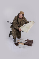 A male actor in the historical uniform of an officer of an army reconnaissance group of the Soviet...