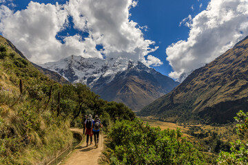 Fototapeta na wymiar Four persons trekking towards Salkantay Mountain near Cusco, Peru.