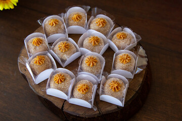Dulce de leche brigadeiro on the decorated birthday table, traditional Brazilian party candy.