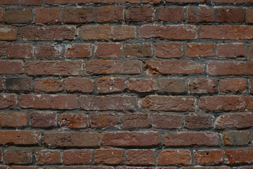 Obraz premium brick red wall. background of a old brick house.