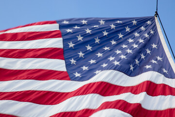 Fototapeta na wymiar American Flag flowing in the breeze