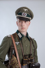 Male actor reenactor in historical uniform as an officer of the German Army during World War II