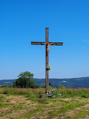 Fototapeta na wymiar Istebna, a wooden cross on the Zloty Gron hill. Silesian Beskids, Poland