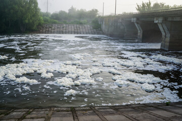 White foam floats on the river.