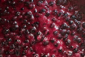 Cooking black currant jam. Berries mixed with sugar
