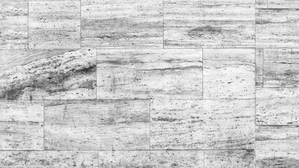 Facade walls are covered with marble tiles